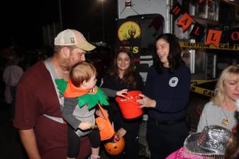 A child picks out candy from the Sparta Ambulance Squad’s trunk at the annual Trunk or Treat on Friday, Oct. 27. (Photo by Dave Smith)