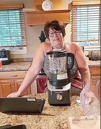 Liane Herman, sales consultant at the Pampered Chef in Highland Lakes, gives a demonstration on the Vernon Chamber Relief Market Facebook page.