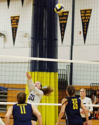 Sparta gets first volleyball win All eyes are on the ball after it was struck by Sparta's Erin Scott (50).