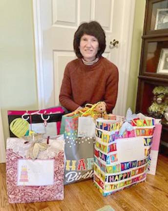 Judy Phillips, co-chair of the Vernon Township Woman’s Club Birthday Bag project, prepares gift bags for residents of the Homestead Rehabilitation and Healthcare Center in Newton who are celebrating their birthdays next month. (Photo provided)