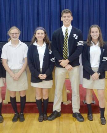 Pope John XXIII Regional High School Class of 2020 graduates (from left) Ashley Potts, Emily Mundt, Douglas Fowler, and Bridget McNally during the school’s monthly liturgy last October. They were among Pope John’s 67 students recognized for their outstanding achievement on the 2020 AP exams. (Photo by Anthony Spaulding/Director of Communications)