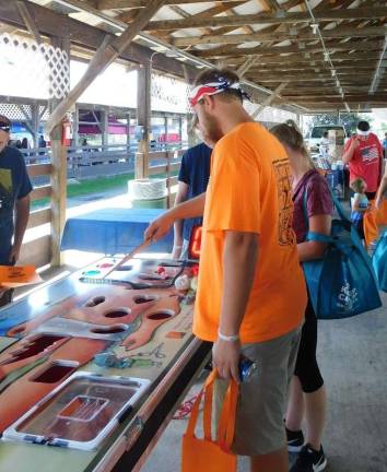 Sunny skies draw thousands to Fairgrounds for Sussex County Day A life-size game of Operation drew attendees to try their hand at "surgery" during Sussex County Day