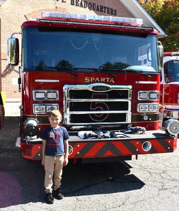Sparta Township observes Fire Prevention Week Colton Steffen from Sparta stands in front of a fire truck.