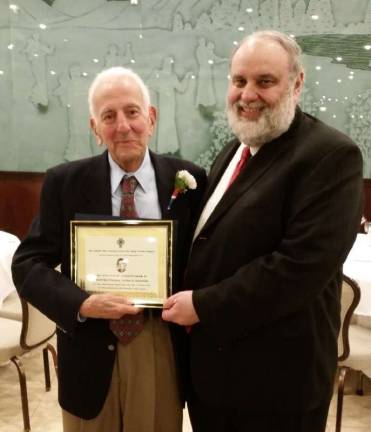 Michael Antoniello (L) recieves an award for his service from Michael Connors of the Catholic War Veterans, in this photo provided by Antoniello's daughter, Sparta resident Marianne Antoniello-Willis.&#xa0; (Photo provided).