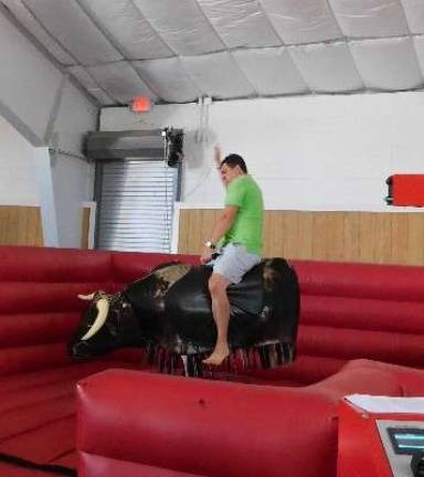 Sunny skies draw thousands to Fairgrounds for Sussex County Day Popular WSUS radio host Steve Andrews took a turn on the mechanical bull