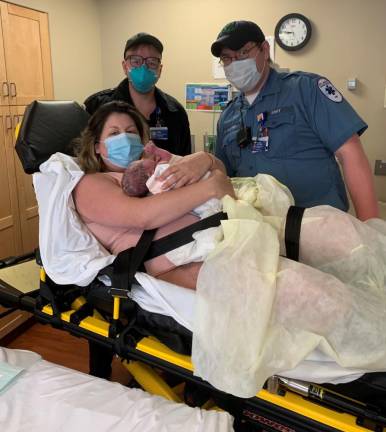 Mom arrives at the hospital with help from local EMTs. Photo provided.