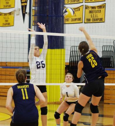 Sparta gets first volleyball win Sparta's Emily Argula (25) leaps in an attempt to intercept the ball struck by Vernon's Katie Owens.