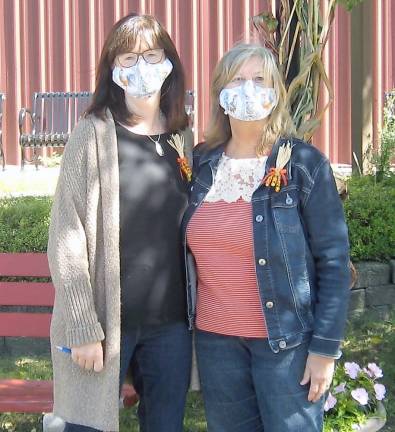 Authors Joan Smith (left) and Jeanne Heinke pose “pandemic style” during the debut and event celebrating their new children’s book Rooster’s Day at the Fair (Photo by Janet Redyke)
