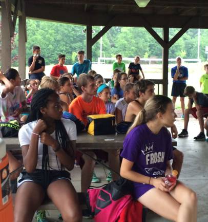 County sports Hall of Famer returns to inspire runners Campers listen intently to Scheid speak.