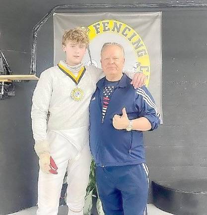 Pope John student wins silver fencing medal Allen Trudnos with couach and father Mark Trudnos