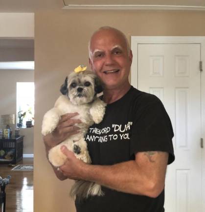 Dom Perruccio of Sparta holds his dog, Cannoli. Her death inspired him to write ‘The Adventures Of Miss Cannoli the Scamp.’ (Photos provided)