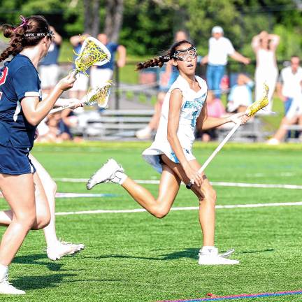 Photos: Spartans in Group 2 final Sparta’s Joey Roque outruns Gracie Shoulberg of Mendham.
