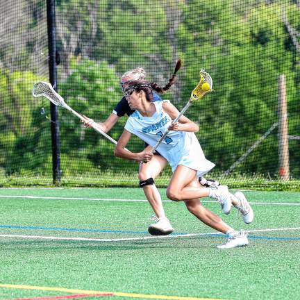 Photos: Spartans in Group 2 final Joey Roque of Sparta dodges Mendham defender Sophie Pyznar.