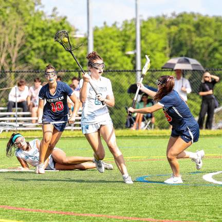 Photos: Spartans in Group 2 final Sparta’s Moira Sweeney dodges a block from Mendham’s Mia Bracuti to advance the possession in the second half.