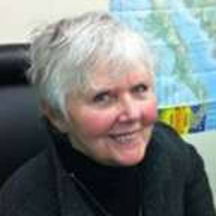 Help 'Project Help' with a cigar Sandy Mitchell, Project Help founder and executive director