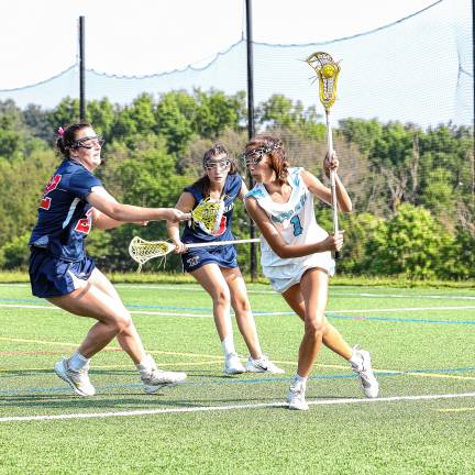 Photos: Spartans in Group 2 final Joey Roque of Sparta dodges a defense block from Gracie Shoulberg of Mendham.