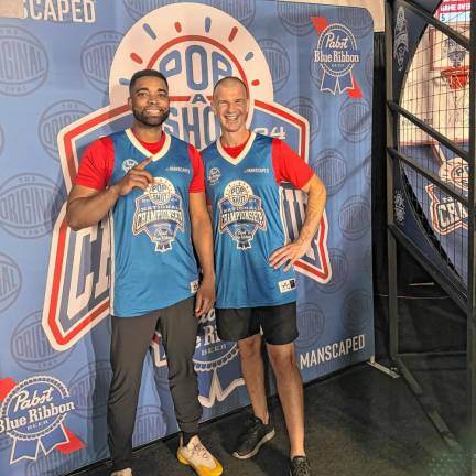 No. 4 in national Pop-A-Shot contest PS3 Luke Kachersky, right, poses with Brian Spellen of Brooklyn, a fellow competitor in the national contest.