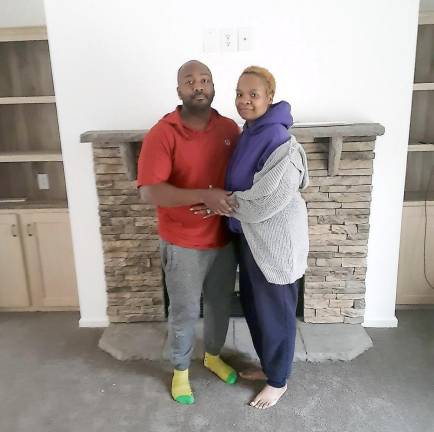 After a long and costly wait, the Polhills are finally home Ray and Naeemah Polhill in their new home. (Photo by Naeemah Polhill)