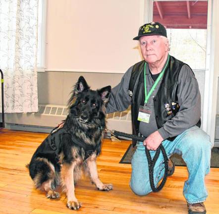Ken Augustin of Lafayette poses with his service dog, Remy. Augustin was in the Army for 41 years as an engineer, designing weapons, such as the M40 and M60.