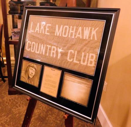 The banner flown by aviator Bernt Balchen over the South Pole in 1929 is on display in the Members' Room at the Lake Mohawk Country Club. The Historic Committee held an event on Friday, Nov 29 to raise funds to reframe and preserve the banner from further deterioration.