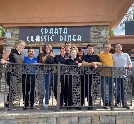 The staff stands in front of the Sparta Classic Diner, which recently reopened after a major fire July 22, 2022. Second from right is Dimitri Kontolios and his son, Mike, is at right. (Photos by Deirdre Mastandrea)