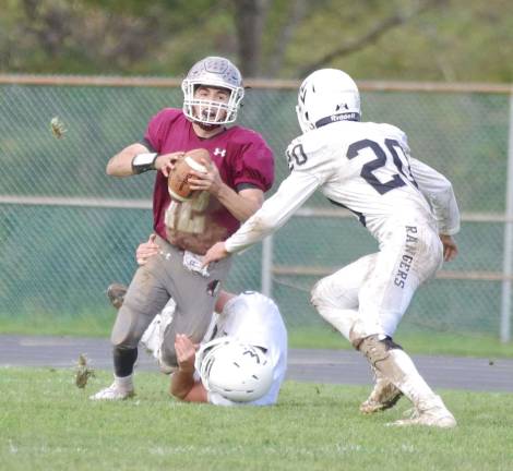 Newton quarterback Michael Freda is in the grasp of a Wallkill Valley defender in the second half. Freda threw the ball for a total of 60 yards. Freda also rushed for 38 yards.