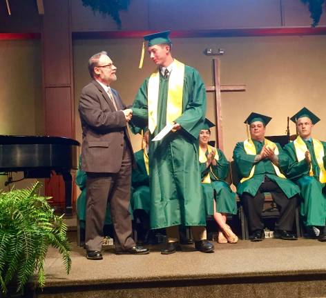 Class of '15 graduates from Veritas Christian Academy Dr.Paul Vincenti presents Chris Carbone Memorial Scholarship to Sam Allison.