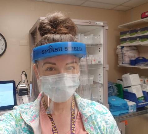 Caitlin Rollman, an ICU nurse, has Covid. She had to call around to five places and drive 40 minutes to get a test, then wait two hours in her car, while feeling sicker than she’s ever felt.