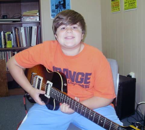 Rapp receives Isak Anderson scholarship award The Isak Anderson Scholarship Award was made possible through the generous support of Tom and Kylen Anderson of Sparta, in memory of their son, Isak, above, a gifted guitarist.