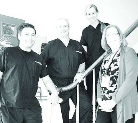 Sparta dentists to benefit local hospice Pictured left to right are Seth J. Perlmutter, DMD; Edward M. Tirpack, DMD, MAGD, Kathleen B. Dunn, DMD join with Cecelia Clayton, Executive Director of Karen Ann Quinlan Hospice at Sparta Dental Designs, 16 Lafayette Road in Sparta. The dentists and their professional team will host the 20th Annual Dental Day for Hospice on Monday, Nov. 3 from 8 a.m. to 1 p.m. For appointments call 973-729-2113.