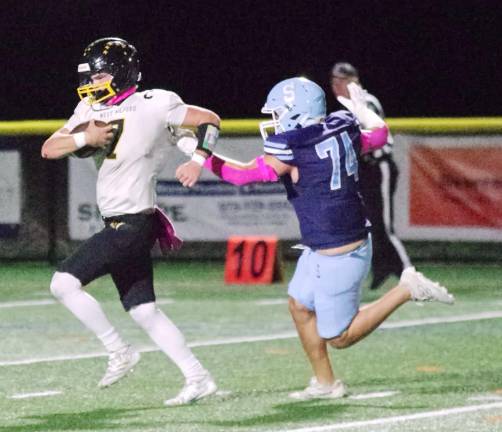 Highlanders rout Spartans, 31-0 In the first half West Milford quarterback Aydin Deane is chased by Sparta defensive end Ryder Chlodnicki in the open field. Deane scored one rushing touchdown.
