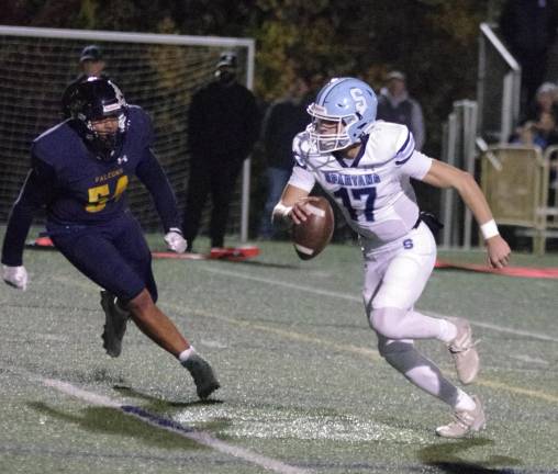 Sparta tops Jefferson, 54-35 Sparta quarterback Shane Hoover keeps the ball and runs to avoid being tackled. Hoover passed for 308 yards resulting in 4 touchdowns.