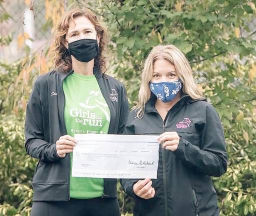 Maureen Dykstra and Melissa Fagersten accept the check from Dick's (Photo provided)