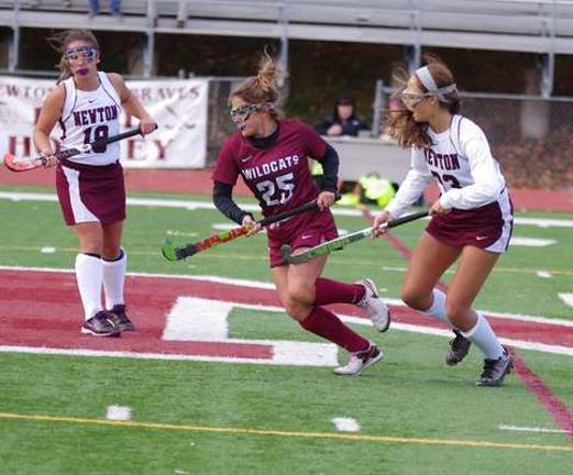Newton bests Whippany Park in field hockey Field hockey players in pursuit of the ball.
