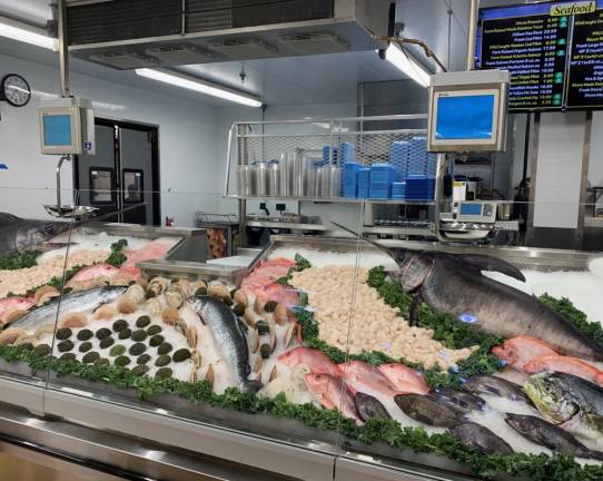 Specialty departments include the Seafood Market with fresh seafood delivered daily.