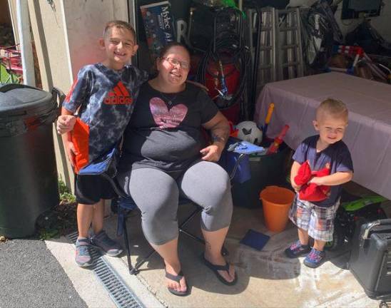 Cassandra Beach with her stepson Sebastian and son Remi.