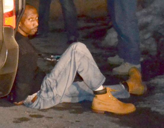 Busted! Photo courtesy of the Sparta Township Police Department James Bond Gang alleged leader Jerry Montgomery sit handcuffed on Radcliff Drive