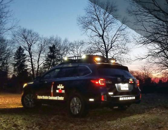 The crew's customized Bigfoot Mobile Command Center and research van