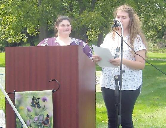 Melanie Trillo and Angela Edson read the names of beloved departed pets (Photo by Janet Redyke)