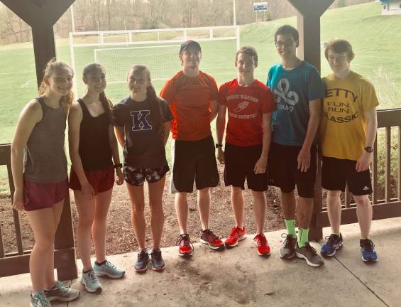 Volunteer coaches are vital to the existence of The Bears Youth Running Program. From left, Bridget O'Keefe, Emily Ward, Ali Schutte, Gavin DeYoung, Devin Johnstone, Mark Young and Dillon Johnstone. Photo by Laurie Gordon