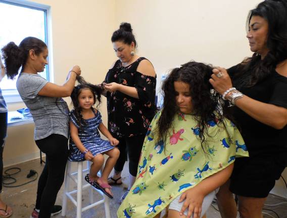 Back to School Fair preps families for September The Felix sisters get their hair done. Professional stylists from several area salons volunteered their time for the Back to School Fair