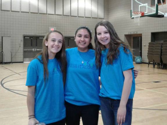 Volunteers step up for homeless vets at Stand Down From left, volunteers Michaela Bleakley, Raina Dhand, and Canavan Storms. All are Sparta HS students. Photo by Meghan Byers