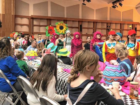 Photos: Mad Hatter’s Tea Party The cast of the Sparta Middle School musical ‘Alice in Wonderland Jr.’ performs for guests.
