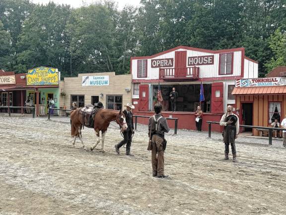 Wild West City remembers ‘Pony Bob’ Cowboy Gabe Wellington walks Ranger into town during an empty saddle ceremony honoring the late Robert ‘Pony Bob’ Erven on Saturday, July 26 at Wild West City in Byram. (Photo by Aidan Mastandrea)