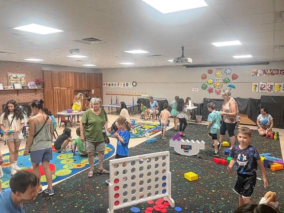 Sparta. Summer Reading Program begins Children play games during the kickoff of the Sparta Public Library’s Summer Reading Program on Monday, June 23. (Photo by Dave Costa)