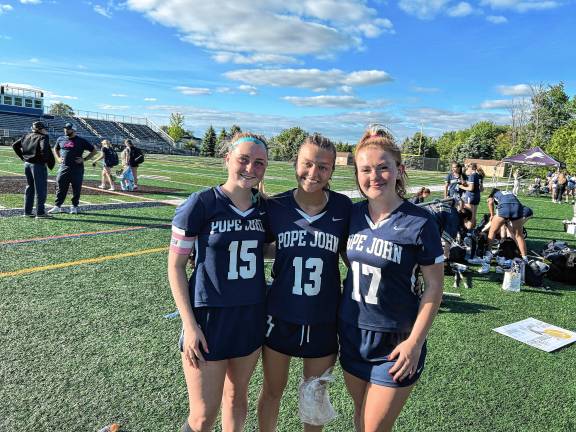 Team raises $1,800 to fight breast cancer Pope John midfielders Keira Donegan, Jordyn Smith and Olivia Zywicki.