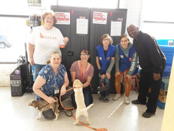 From left are Debbie Kowalchuk of One Step Closer Animal Rescue (O.S.C.A.R.); Holly Perry-Doyle, team leader at Ocean State Job Lot’s Sparta store; Rena Krause, OSJL area supervisor; Grace Giacala and Briel Kocaj, OSJL department heads; and Troy Jones, OCJL assistant team leader.