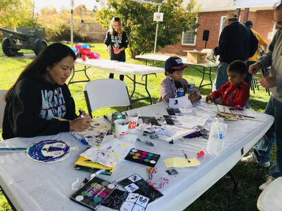 Children and parents create fun decorations out of paper plates at Kiwanis Family Fun Day on Sunday, Oct. 13, 2019.