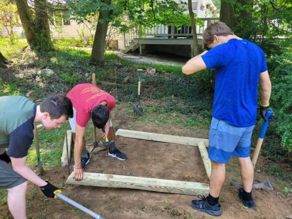 Scouts work on Brendan Del Coro’s Eagle Scout project, which was building horseshoe pits at Lakeview Park.