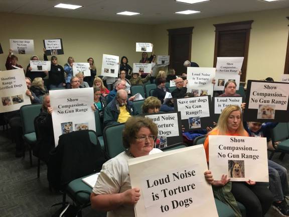 Opposition mounts against proposed Hopatcong Police gun range Hopatcong says no final decision on range has yet been made Roomful of protesters hold signs against police shooting range at Hopatcong Town Council meeting Photos by Amy Shewchuk